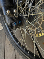 Titanium Talaria front axel pinch bolts